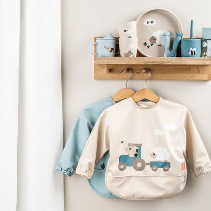 Lopende zak slabbetje Tiny farm Sand koop je bij Babywinkel
