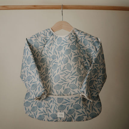 <tc>Mushie</tc> Babero Flores Azules Manga Larga